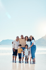 Image showing Family, beach portrait and smile on vacation, bonding and love in summer sunshine by mock up space. Group, men and women with children with happiness, freedom and adventure by sea waves on holiday