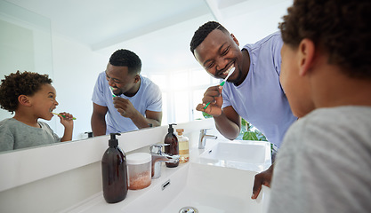 Image showing Smile, brushing teeth and father with son in bathroom for dental, morning routine and cleaning. Teaching, self care and toothbrush with black man and child at home for family wellness and hygiene