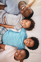 Image showing Happy black family, bed portrait and top view with happiness, kids and together with dad, mom and love. African children smile, parents and bedroom for bonding, care or support in morning for holiday