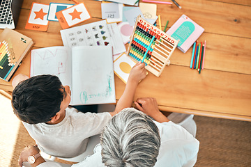 Image showing School, math and child learning with a teacher for education, studying or teaching in a class. Above, table and boy student using an abacus for counting with an elderly woman for help with homework