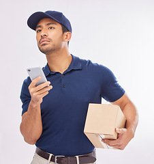 Image showing Delivery, ecommerce and courier with a phone using map to navigate with mobile app on the internet, web or website. Box, package and man worker holding shipment isolated in a studio white background