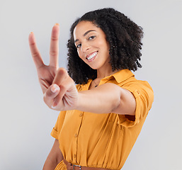 Image showing Happy, peace sign and portrait of woman in studio for positive, agreement and support. Thank you, yes and emoji with female isolated on gray background for achievement, confident and thank you