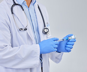 Image showing Injection, doctor hands and vaccine vial in studio for safety, healthcare and pharmaceutical medicine. Closeup, vaccination and liquid bottle for virus risk, immunity and medical antibiotics drugs