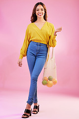 Image showing Portrait, shopping and woman nutritionist with fruit in studio for health, diet and healthy living on pink background. Face, groceries and happy girl customer with organic product, nutrition or detox