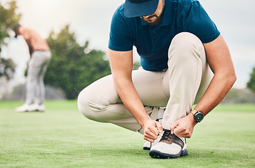 Image showing Sports, tying and shoes of man on golf course for training, games and tournament match. Ready, start and tie laces with athlete playing in club on lawn field for relax, golfing and competition