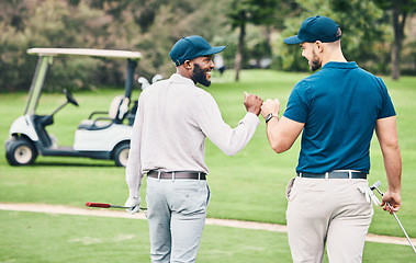 Image showing Man, friends and fist bump on golf course for sports, partnership or trust on grass field together. Happy sporty men bumping hands or fists in collaboration for good match, game or competition