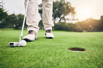 Image showing Golf, closeup and golfer or player hit ball and professional athlete training and putting on a filed as exercise or workout. Feet, equipment and gentleman or person relax and playing a sport