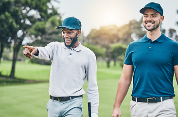 Image showing Friends, men on golf course and black man pointing, walking and talking on grass at game. Health, fitness and friendship, happy golfer man and friend with smile walk in nature on weekend together.