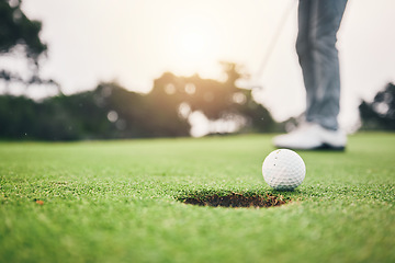 Image showing Sports, golf ball and hole on course in club for competition match, tournament and training. Target, challenge and games with equipment on grass field for practice, recreation hobby and practice