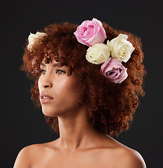 Image showing Thinking, beauty and flowers with a model black woman in studio on a dark background for natural skincare. Wellness, luxury and idea with an attractive young female wearing a flower crown or wreath