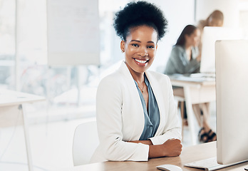 Image showing Leadership, happy and portrait of a businesswoman in the office with a computer working on a project. Happiness, smile and African female corporate manager sitting at her desk with a pc in workplace.