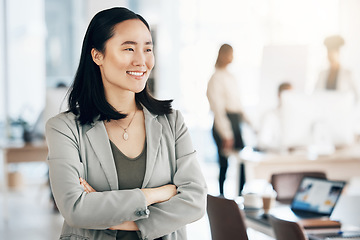 Image showing Asian, business woman and arms crossed with smile, thinking with leadership and professional mindset in workplace. Career, success and corporate female in Japanese office, happiness and confidence