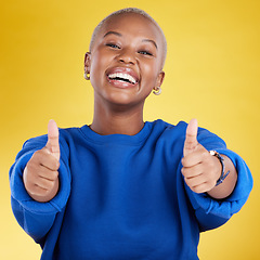 Image showing Laughing, portrait and black woman with thumbs up in studio isolated on a yellow background. Happy, emoji face and funny female with hand gesture for agreement, support or approval, like or success.