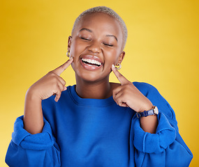 Image showing Fashion, smile and black woman happy pointing at her face excited and confident isolated in a studio yellow background. Style, happiness and young female with a positive mindset and confidence