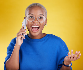 Image showing Phone call, talking and laughing black woman in studio isolated on a yellow background. Cellphone, contact and happy African female with mobile smartphone for chatting, funny conversation or speaking