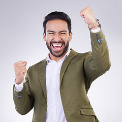 Image showing Yes, winner and happy man portrait isolated on white background celebration for opportunity, bonus or winning. Asian business person, fist pump and celebrate competition or promotion news in studio