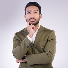 Image showing Business man, thinking face and planning in studio with ideas or strategy on a gray background. Asian male entrepreneur think with hand on chin while pensive or contemplating question or thought