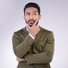 Image showing Business man, hand on face and thinking in studio with ideas or strategy on a gray background. Serious asian male entrepreneur think while confused, doubt or contemplating question on mockup space