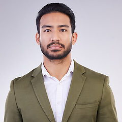 Image showing Business man, serious face and portrait in studio with pride for career or job on a gray background. Asian entrepreneur person with dedication and ambition for professional occupation and mindset