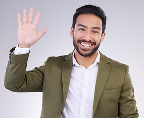 Image showing Portrait, greeting and Asian man with success, wave and guy against grey studio background. Face, Japanese male and entrepreneur with smile, opportunity and hello with employee, happiness and welcome