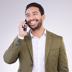 Image showing Business man, smile and phone call in studio for communication and networking on gray background. Asian male entrepreneur with smartphone for conversation or talking to contact for happy negotiation