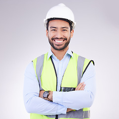 Image showing Construction worker in portrait, man with crossed arms and smile, architect or engineer in building industry on studio background. Happy male contractor, mockup and professional builder with helmet