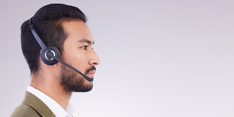 Image showing Call center, man and face profile with headset and mic, CRM and contact us with mockup space. Communication, customer service or tech support with telemarketing and serious male on studio background