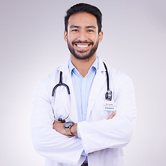 Image showing Doctor, man with arms crossed in portrait and smile, health and medical professional on studio background. Male physician, cardiovascular surgeon with stethoscope, happiness in medicine and mockup