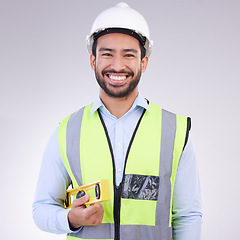 Image showing Construction worker in portrait, man with tools and smile, architect or engineer in building industry on studio background. Happy male contractor, mockup and professional builder with helmet