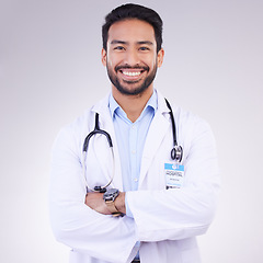 Image showing Doctor, man with arms crossed and happy in portrait, health and medical professional on studio background. Male physician, cardiovascular surgeon with stethoscope, happiness in medicine and mockup