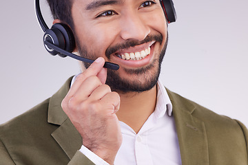 Image showing Call center headset of happy man isolated on a white background telemarketing, telecom or global support. Asian international agent, virtual consultant or business salesman or person talk in studio