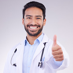 Image showing Portrait of man doctor thumbs up isolated on a white background support, thank you and healthcare services goals. Medical asian professional in like, agreement or success hand sign or emoji in studio