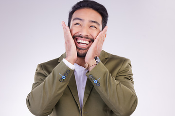 Image showing Excited, thinking and Asian man with smile, success and profit growth against a grey studio background. Japan, male employee and entrepreneur with hands on face, winner and victory with happiness