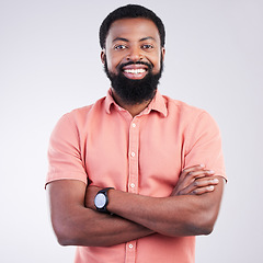 Image showing Happy, arms crossed and portrait of black man in studio for confidence, positive and laughing. Funny, carefree and happiness with male isolated on gray background for cheerful, achievement and pride