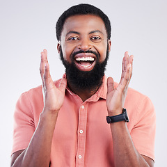 Image showing Happy, surprise and portrait of black man in studio for shocked, announcement and accomplishment. Smile, winner and achievement with male on gray background for celebration, omg and good news