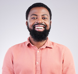 Image showing Happy, confident and portrait of black man in studio for smile, positive and laughing. Funny, carefree and happiness with male isolated on gray background for cheerful, achievement and pride