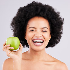 Image showing Portrait, health and black woman with apple, diet and happiness against a grey studio background. Face, African American female and lady with fruit, wellness and healthy lifestyle with smile and joy