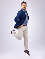 Image showing Jump, happy and portrait of man in studio with positive mindset, happiness and joy on white background. Winner, success mockup and isolated male jumping with smile for energy, freedom and confidence