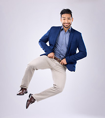 Image showing Happy, crazy and portrait of an Asian man jumping isolated on a white background in a studio. Excited, smile and a Japanese businessman in the air for excitement and clicking heels on a backdrop