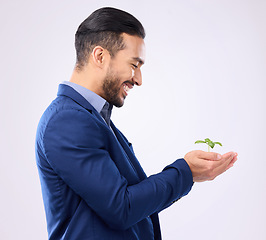 Image showing Happy man, plant in hands and business growth isolated on a white background in eco friendly investment. Asian person with sapling soil in palm for sustainable startup and green investing in studio