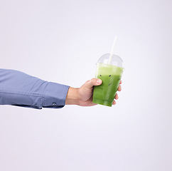 Image showing Green juice in man hands isolated on a white background diet, detox and healthy breakfast or protein drink offer. Person or nutritionist hand holding or giving smoothie for vegan choice in studio