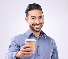 Image showing Business man, coffee cup toast and portrait in studio with smile, motivation and start morning by background. Happy asian businessman, takeaway latte and cheers for success, giving and offer at job