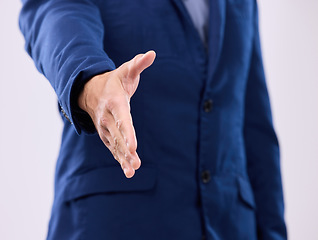 Image showing Open hand shake, studio and business man with welcome, deal or agreement for partnership by background. Zoom, entrepreneur and handshake for hiring opportunity, greeting or onboarding with respect