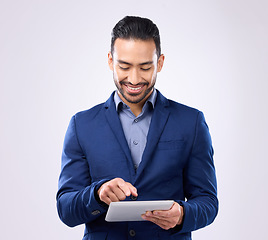 Image showing Asian man, business and tablet in studio for communication and network connection. Happy male model isolated on a gray background with tech for mobile app, online chat and typing search on internet