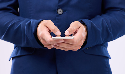 Image showing Phone in hands, typing and man in studio for communication with network connection on social media. Hand of male with smartphone for internet search, mobile app and online chat on a white background