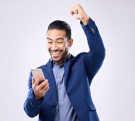 Image showing Happy man, phone and celebrate success in studio for winning, deal or bonus. Business male isolated on gray background with smartphone and fist for mobile app, internet competition or lottery winner