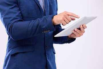 Image showing Business man, tablet in hands and in studio for communication with network connection on social media. Hand of male typing internet search, mobile app and online contact chat on isolated background