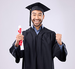 Image showing Graduation portrait of asian man, certificate and success isolated on studio background for university achievement. Fist pump of happy student, person or college graduate and diploma, award and goals