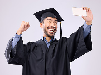 Image showing Man, graduate and selfie with smile for scholarship, profile picture or social media against a gray studio background. Happy excited male academic smiling for graduation photo, memory or online post