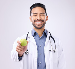 Image showing Apple, doctor portrait and man happy with fruit recommendation for weight loss diet, medical healthcare or detox. Wellness, nutritionist nurse and male vegan giving food isolated on gray background